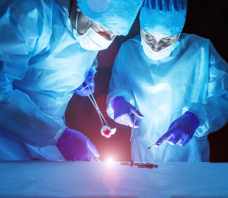 Two Doctors Perform Laser Surgery To Treat Varicose Veins And He